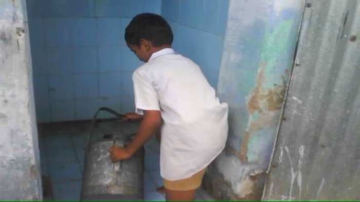 students cleaning toilets