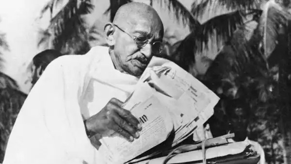 gandhi reading newspaper