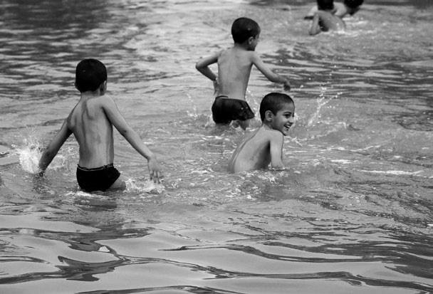 boys playing in pond