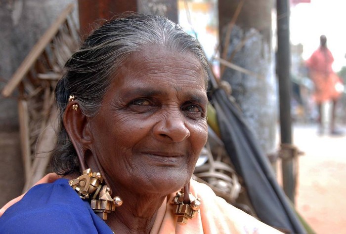 old woman with paambadam
