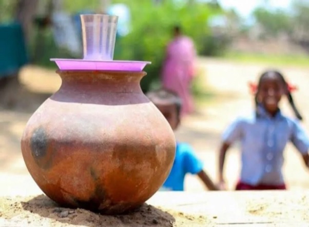 students rushing for water