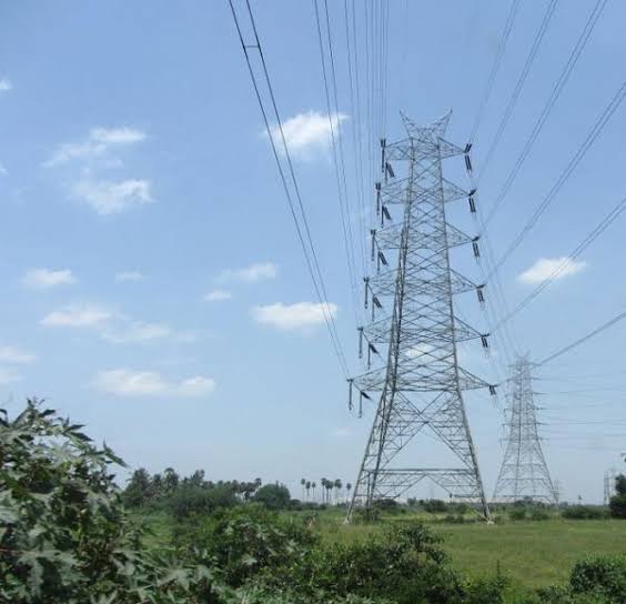 high voltage towers on farm
